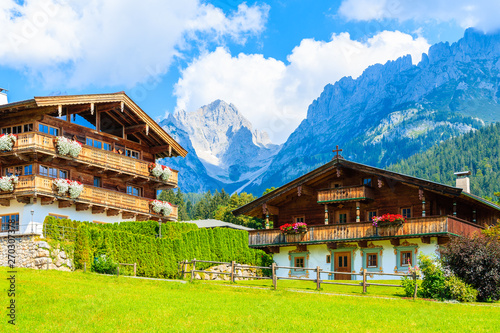 Traditional alpine houses in village of Going am Wilden Kaiser on beautiful sunny summer day, Tirol, Austria photo
