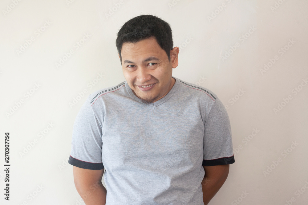 Young Asian Man Smiling Happily Young Asian Man Smiling Happily