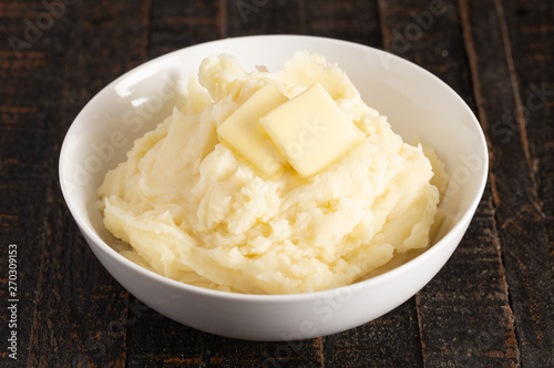 Mashed Potatoes with Butter on a Wooden Table