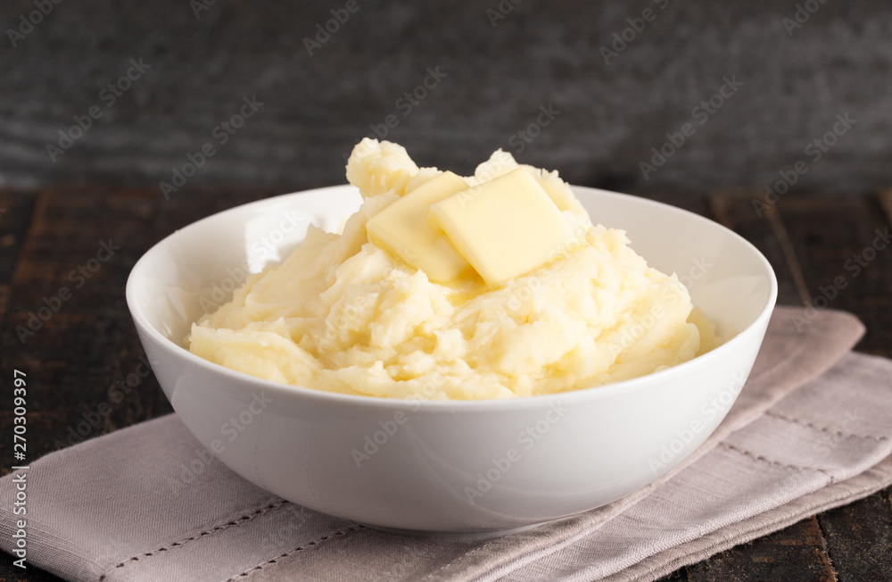 Mashed Potatoes with Butter on a Wooden Table Mashed Potatoes with Butter on a Wooden Table