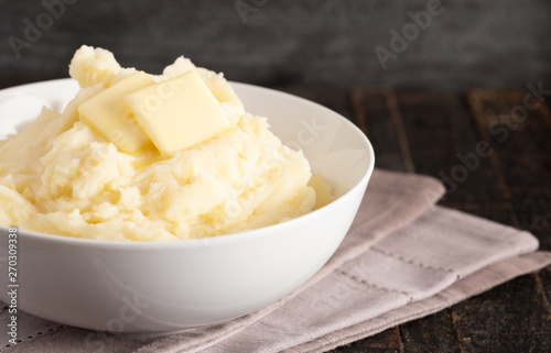 Mashed Potatoes with Butter on a Wooden Table