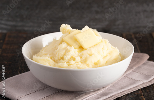 Mashed Potatoes with Butter on a Wooden Table