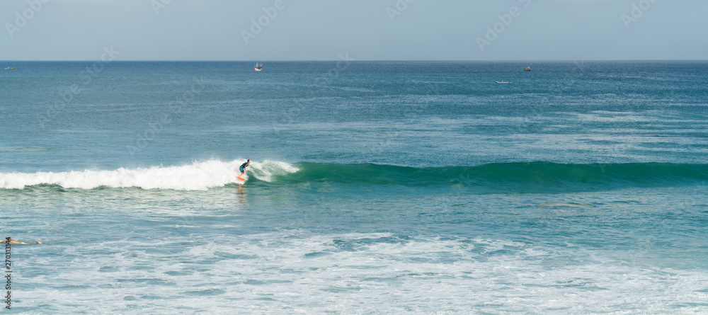 Bali ocean waves on surf spot Dreamland. Indonesia blue ocean resort