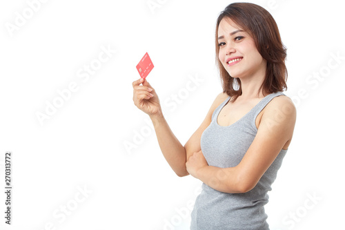 Young smiling  asian woman presenting credit card
