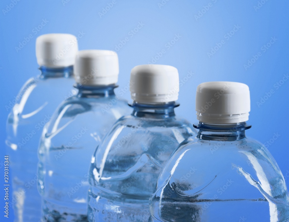 Plastic bottles of water isolated on background Plastic bottles of water isolated on background