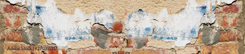 Old damaged brick wall with shabby plaster.