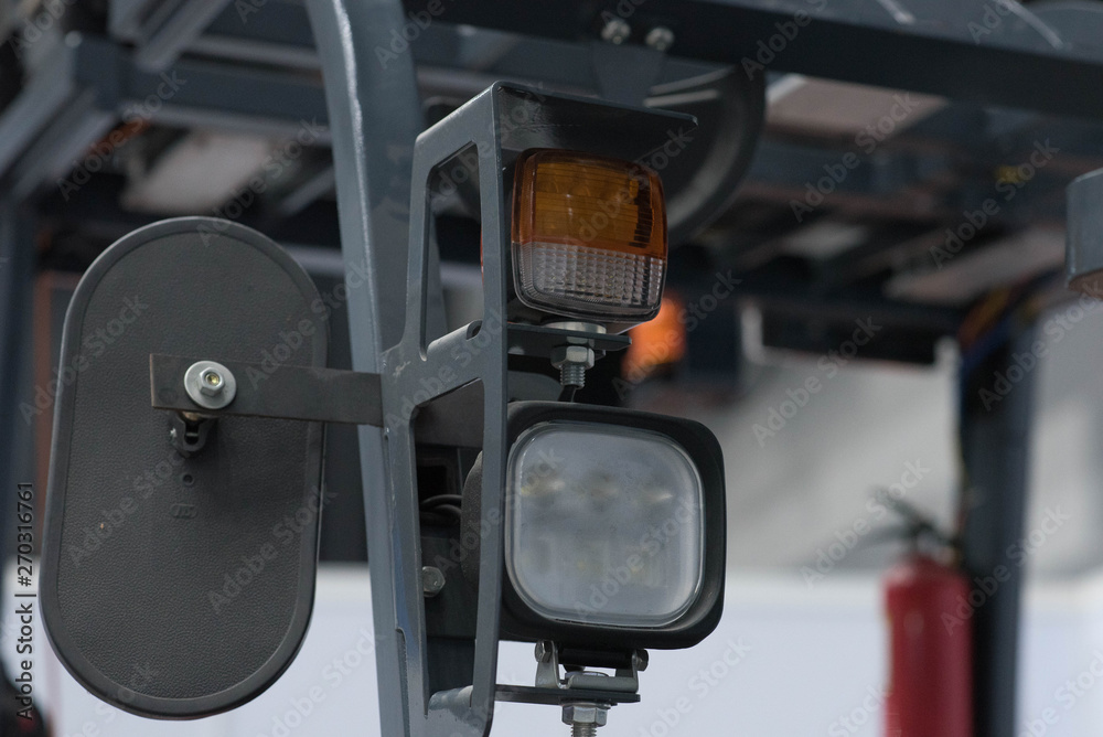 Head light forklift in warehouse. Head light forklift in warehouse.