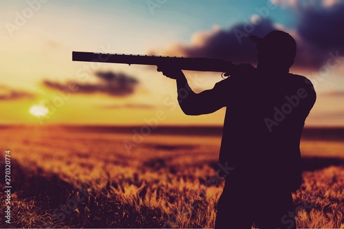 Male Hunter with Rifle on natural background