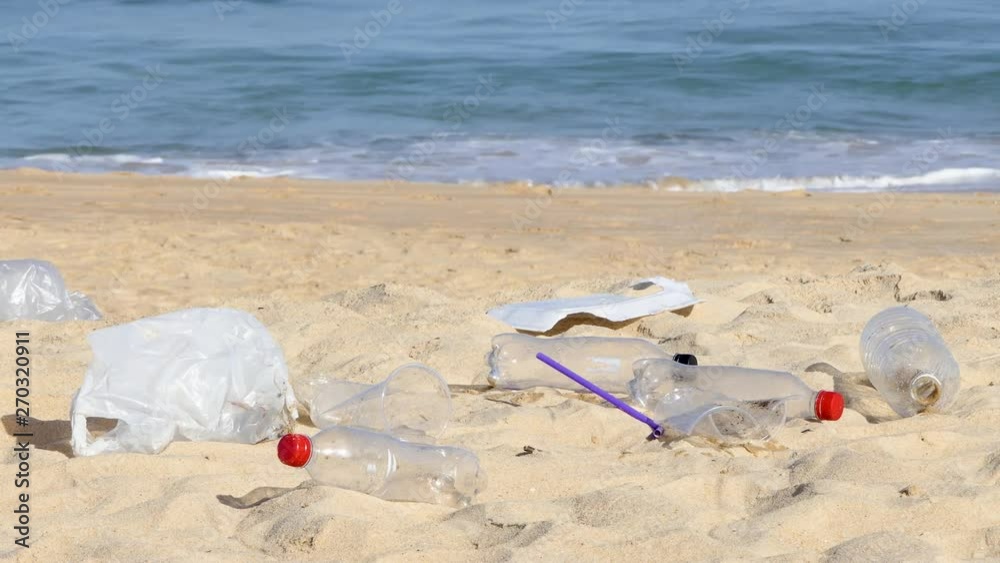Garbage at the beach hurting the beautiful environment Garbage at the beach hurting the beautiful environment