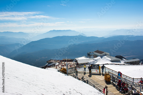 Kunming,China - 2019 April 24 : On the top of Dragon snow mountain in Lijiang Kunming China which covered by snow and crowed of tourist.