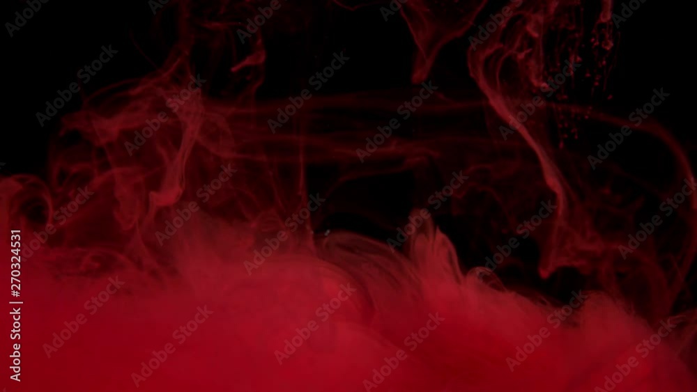 Red colour cloud smoke - ink on the water on black background. Camera fixed, angle neutral, close up shoot, slow motion. (TOKYO, JAPAN - 10th May 2019). Red colour cloud smoke - ink on the water on black background. Camera fixed, angle neutral, close up shoot, slow motion. (TOKYO, JAPAN - 10th May 2019).