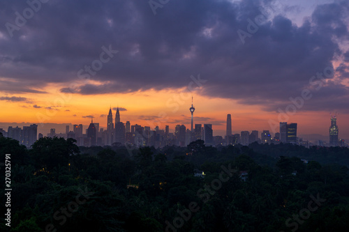 Cloudy sunrise over downtown Kuala Lumpur (KL). KL is the capital of Malaysia. 