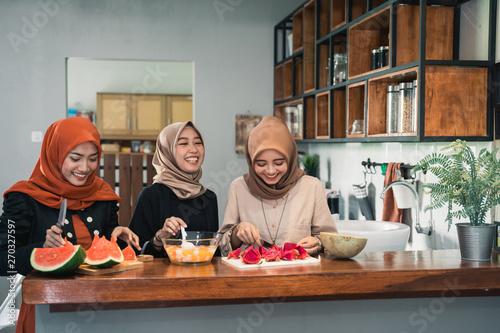 young hijab woman prepare fruits to make cocktail for breaking fast serve