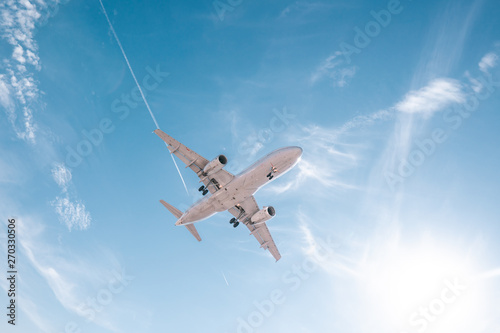 Fototapeta Naklejka Na Ścianę i Meble -  Aviation, travel, air transportation concept. Airplane in blue sky