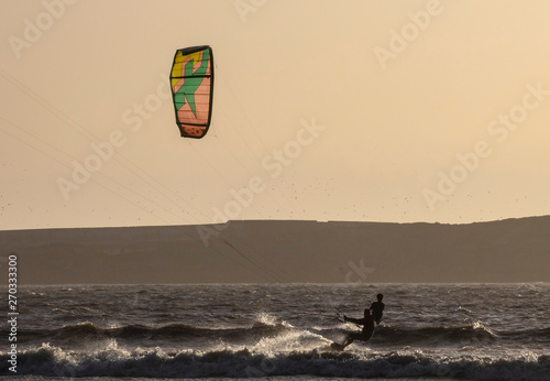 Kitesurfers at sunset in Essaouira, Morocco