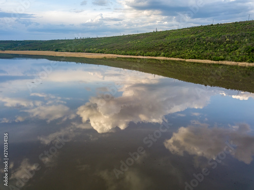 Flight over the river and forest at spring time. Dniester river of Moldova republic.