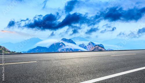 Empty asphalt road and beautiful huangshan mountains with clouds sea nature landscape