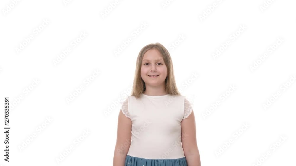 Video portrait of a beautiful girl clapping her palms isolated on white background. Childhood concept. Studio shot of child emotions in 4K definition. Video portrait of a beautiful girl clapping her palms isolated on white background. Childhood concept. Studio shot of child emotions in 4K definition.