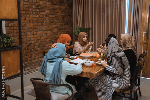Portrait hijrah family when breaking fast together in the afternoon at home