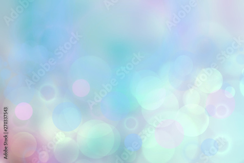 Abstract blue pastel bokeh background texture with bright soft color circles. Space for your text.
