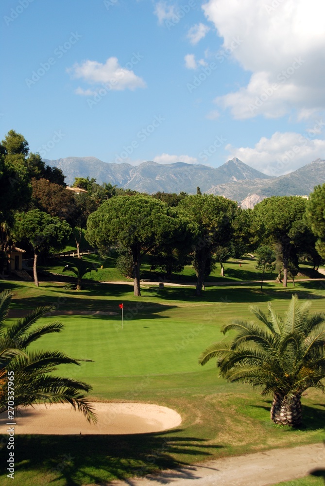 View across the Rio Real Golf Club with mountains to the rear, Marbella, Spain.