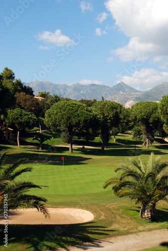 Obraz na płótnie View across the Rio Real Golf Club with mountains to the rear, Marbella, Spain. w salonie