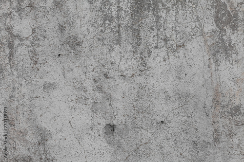 The texture of old concrete wall for background with a concrete splash on the wall 