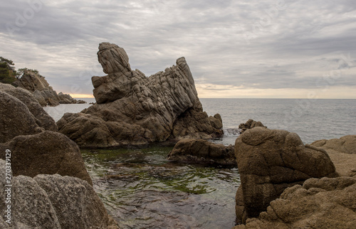 The cala dels frales in lloret de mar at sunrise