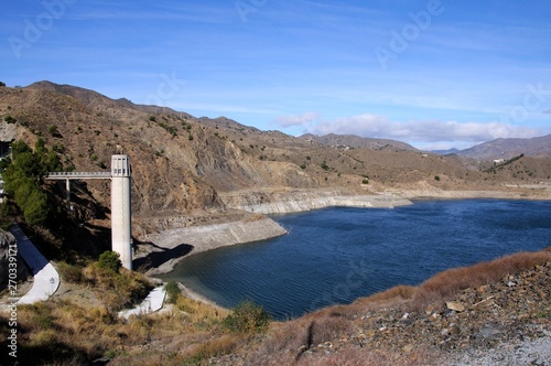 View across La Concepcion reservoir towards the mountains (Embalse del Limonero), Malaga, Spain.