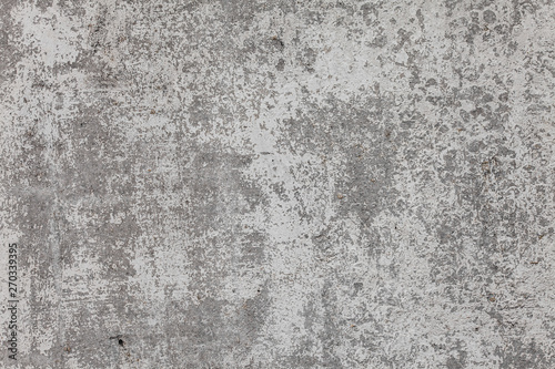 The texture of the old grey concrete wall with scratches, cracks, dust, crevi...