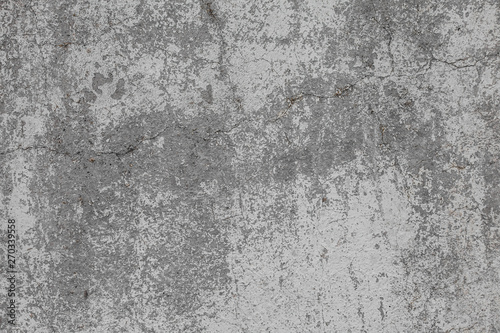 The texture of the old grey concrete wall with scratches, cracks, dust, crevi...