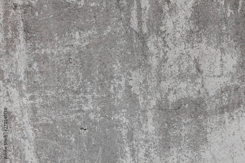 The texture of the old grey concrete wall with scratches, cracks, dust, crevi...