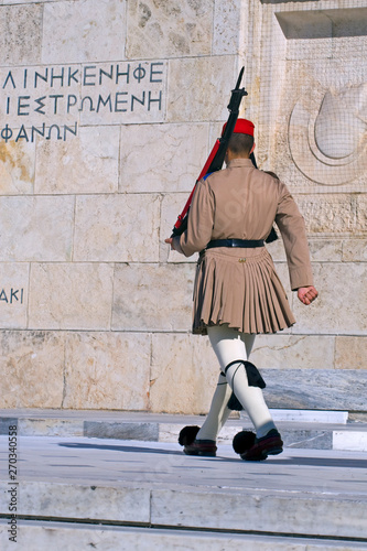 back of the soldier Evzona at the post near the grave of the unknown soldier in Athens on Syntagmatos Square
