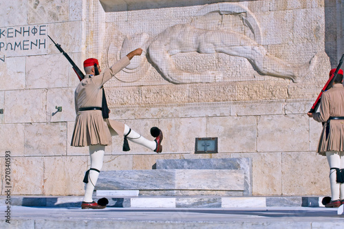  back of the Evzone soldiers at the post near the grave of the unknown soldier in Athens on Syntagmatos Square, the changing of the guard photo