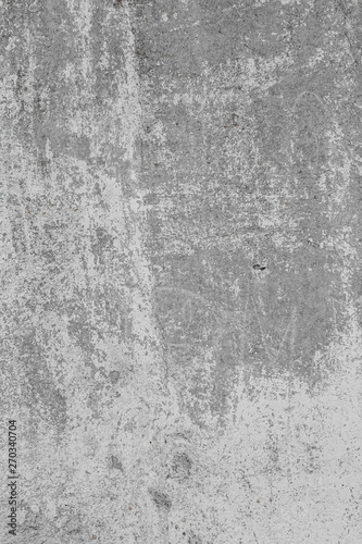 The texture of the old grey concrete wall with scratches, cracks, dust, crevi...