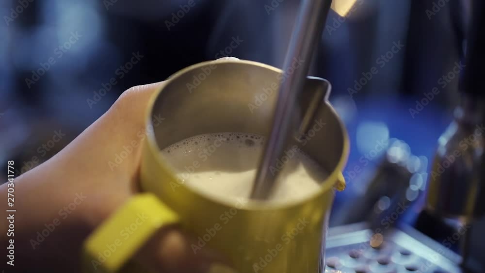 Steaming milk on professional coffee machine Steaming milk on professional coffee machine