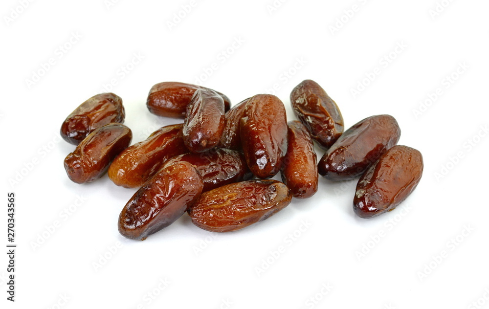 Dried dates over white background. Heap of dried dates isolated on white background. Dried dates over white background. Heap of dried dates isolated on white background.