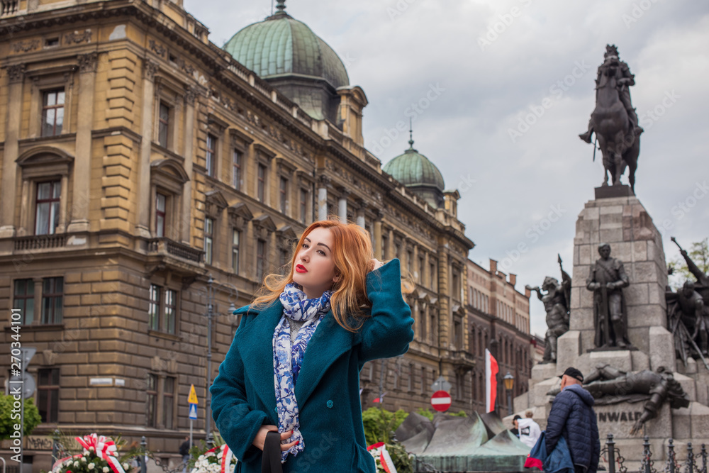Tourism concept. Beautiful woman look at view of city streets, centre of city. Vacation in Krakow Tourism concept. Beautiful woman look at view of city streets, centre of city. Vacation in Krakow