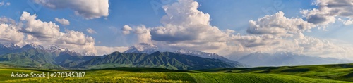Panorama of a mountain valley in summer. amazing nature, mountains lit by the sun in clear weather, summer in the mountains. Travel and camping, tourism