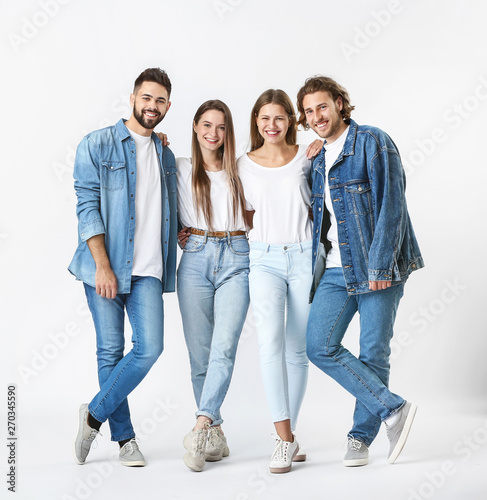 Stylish young people in jea...