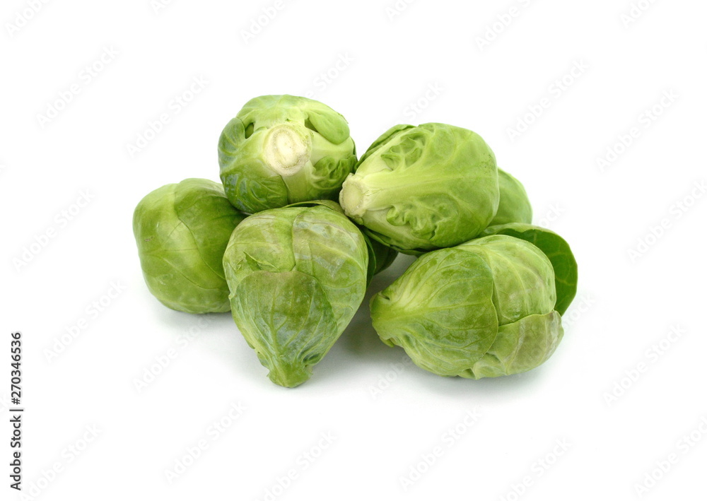 a pile of Brussels sprouts on a white background. a pile of Brussels sprouts on a white background.