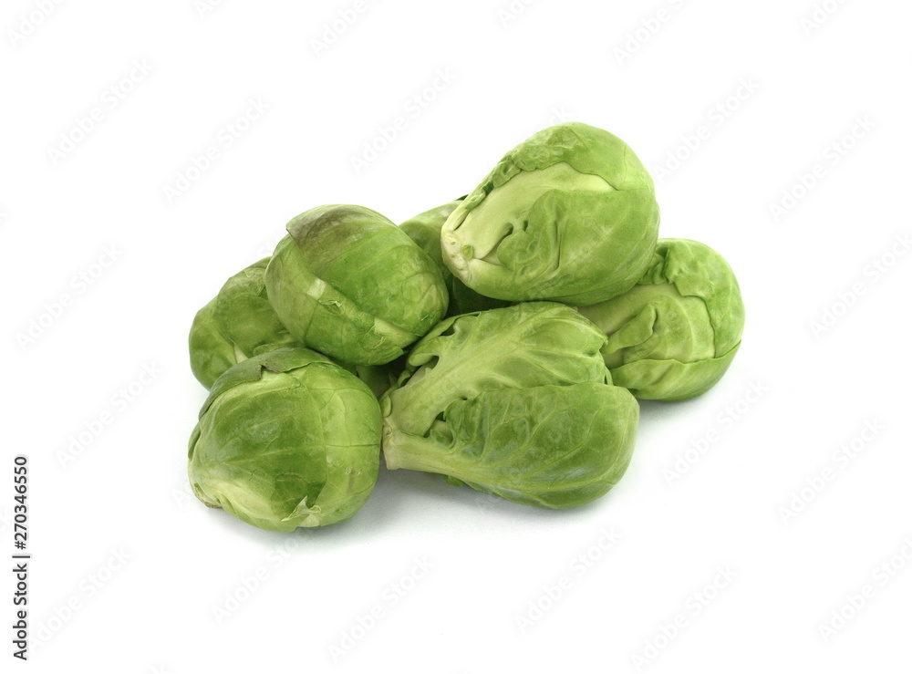 a pile of Brussels sprouts on a white background. a pile of Brussels sprouts on a white background.