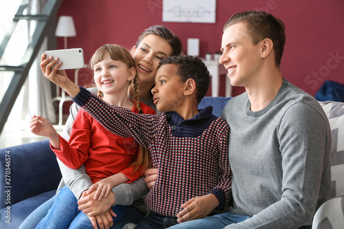 Happy couple with adopted c...