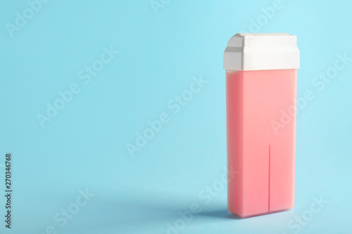 Cartridge with wax for hair removing on color background