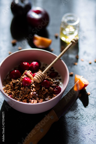 Breakfast with granola, cherry and honey.healthy breakfast Proper nutrition.