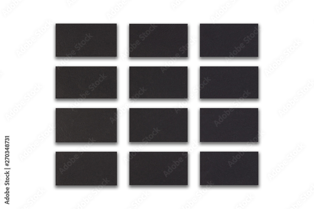 Mockup of horizontal Black business cards stacks arranged in rows at white textured paper background. Mockup of horizontal Black business cards stacks arranged in rows at white textured paper background.