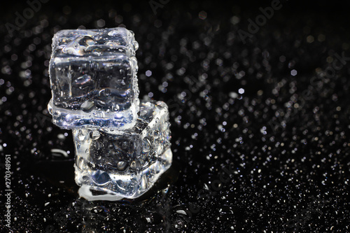 ice cubes on black background. © peterkai
