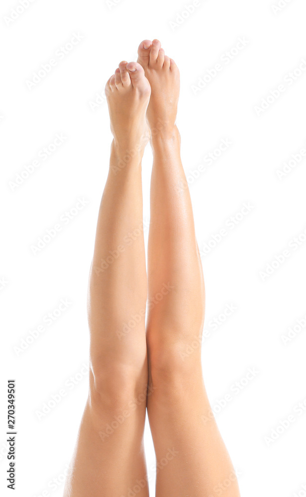 Legs of beautiful young woman after depilation on white background Legs of beautiful young woman after depilation on white background