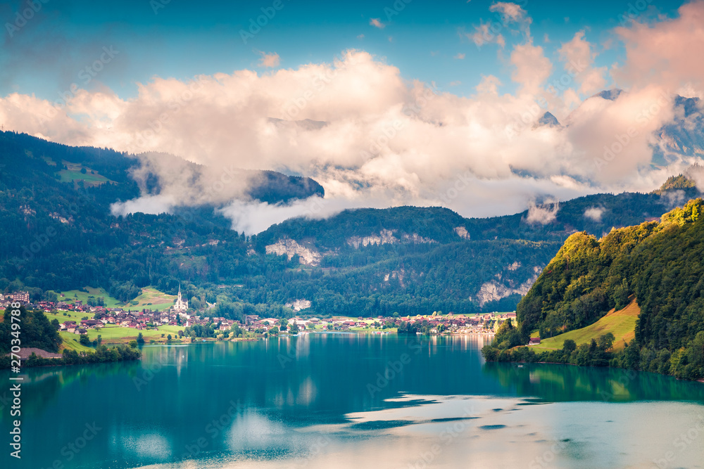 Splendid summer view of Lungerersee lake. Colorful morning scene of Swiss Alps, Lungern village location, Switzerland, Europe. Beauty of nature concept background.