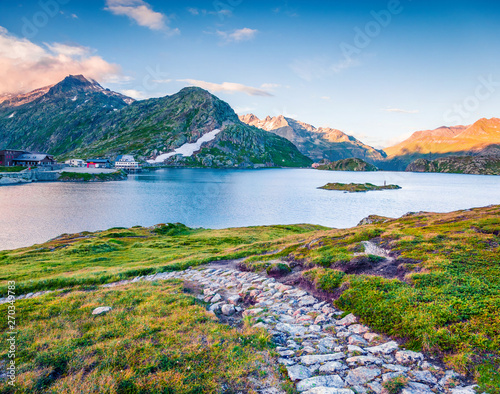 Great summer view of Totensee lake on the top of Grimselpass. Picturesque outdoor scene of Swiss Alps, Bern canton, Switzerland, Europe. Beauty of countryside concept background. photo